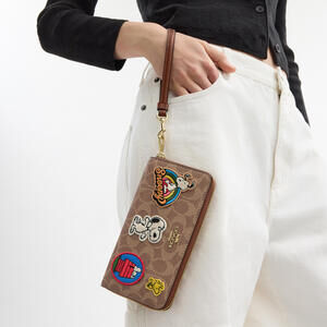 Coach X Peanuts Long Zip Around Wallet In Signature Canvas With Patches